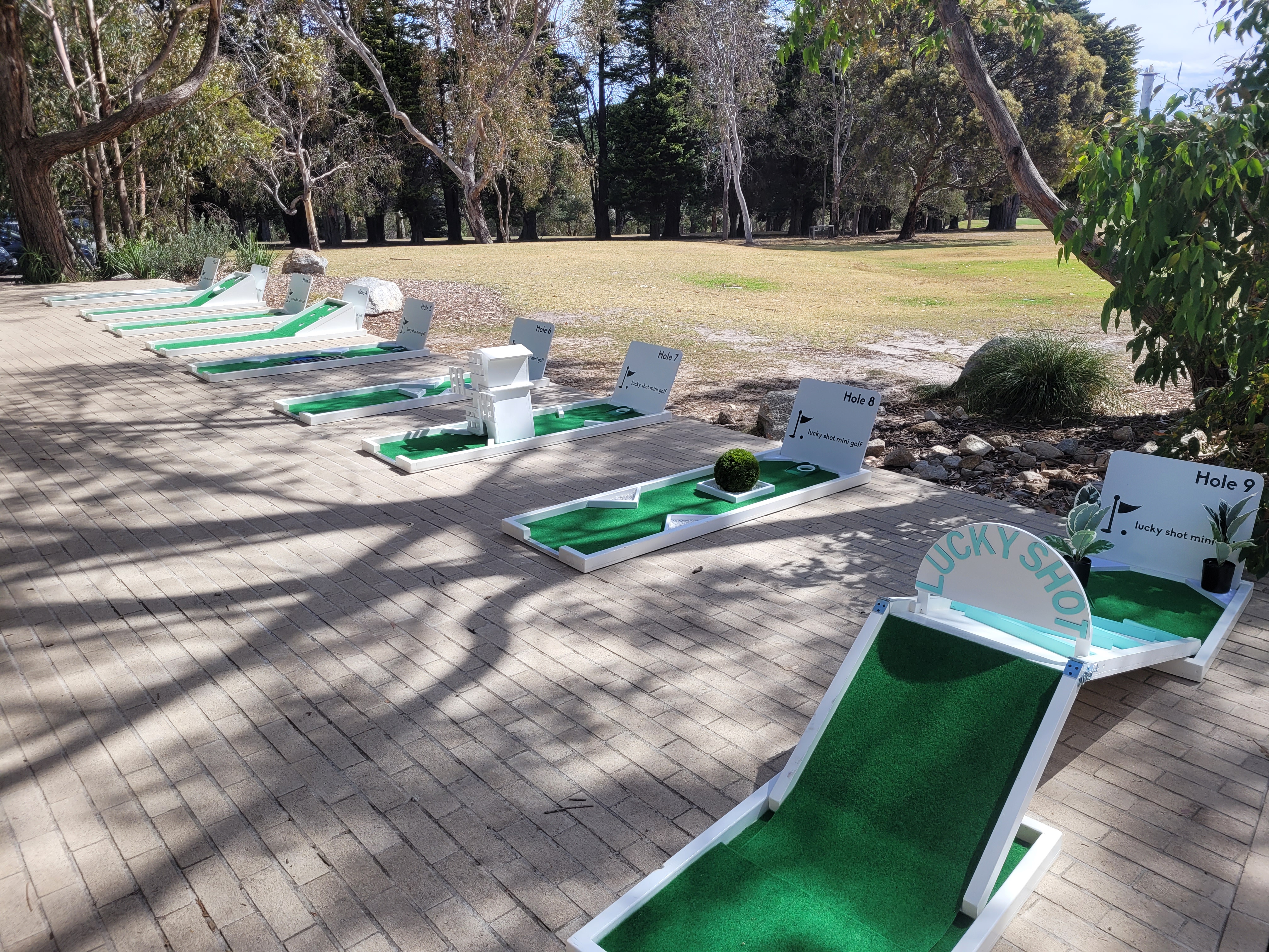 Mini golf course set up in a beautiful outdoor garden venue